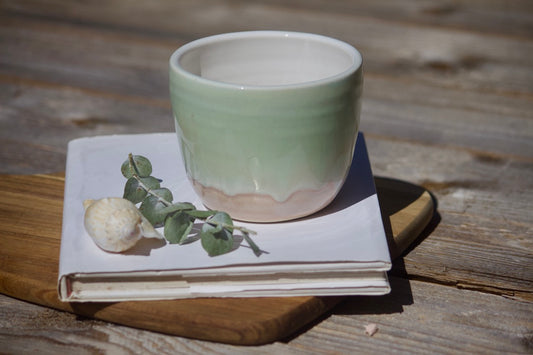 Lime green and orange ceramic cup