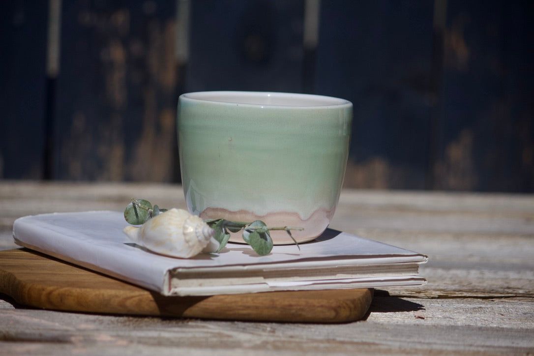 Lime green and orange ceramic cup
